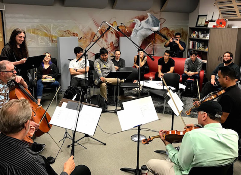 Students playing instruments in a music classrom